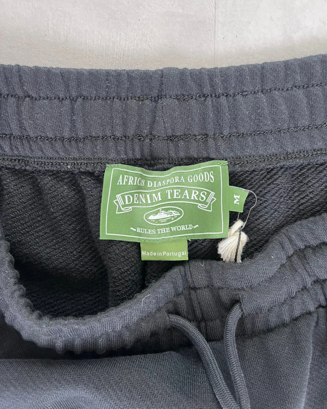 Corteiz X Denim Tears Cotton Wreath Bottoms black – M